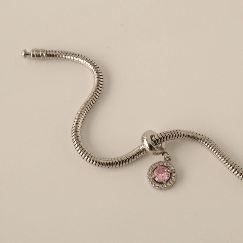 Berloque em Aço Inox Cravejado Rosa Claro