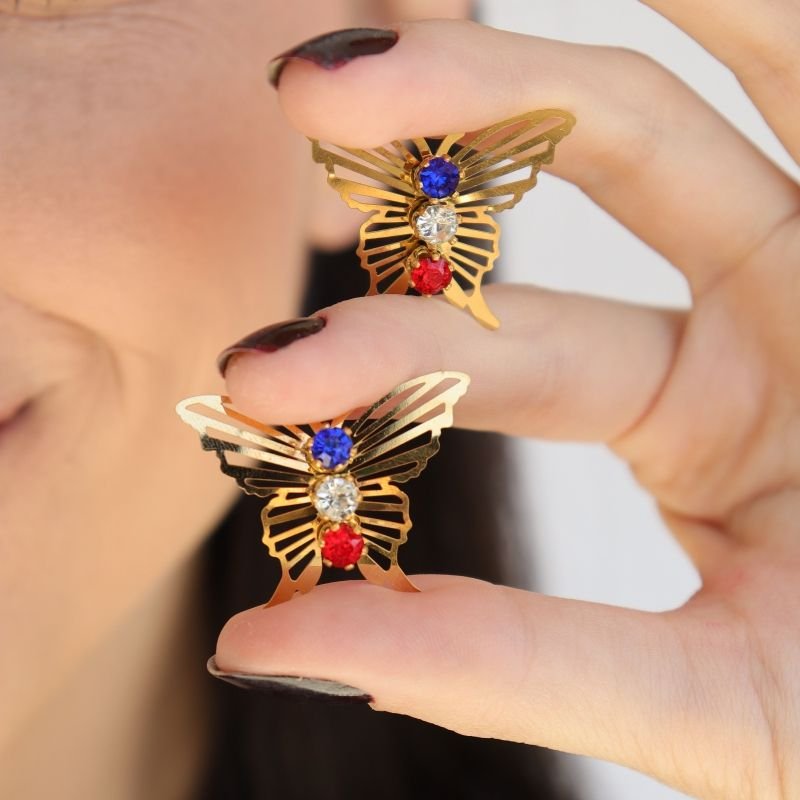 Brinco Borboleta em Aço Inox (Cor das Pedras pode Variar)